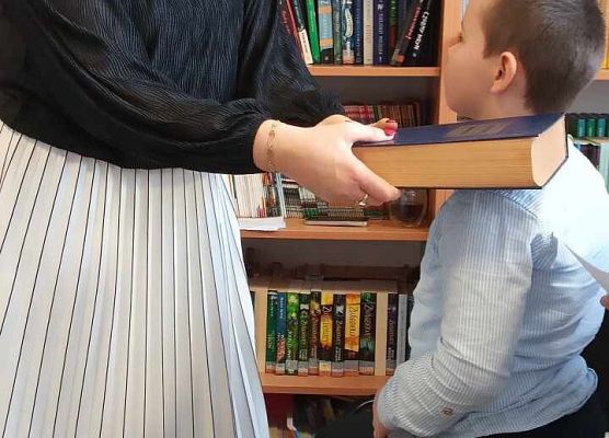 Grafika 11: Pasowanie na czytelnika