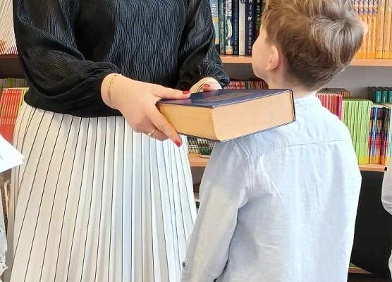 Grafika 28: Pasowanie na czytelnika